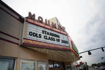 Vintage theater marquee reading "Starring ODLS Class of 2025" with bright bulbs.