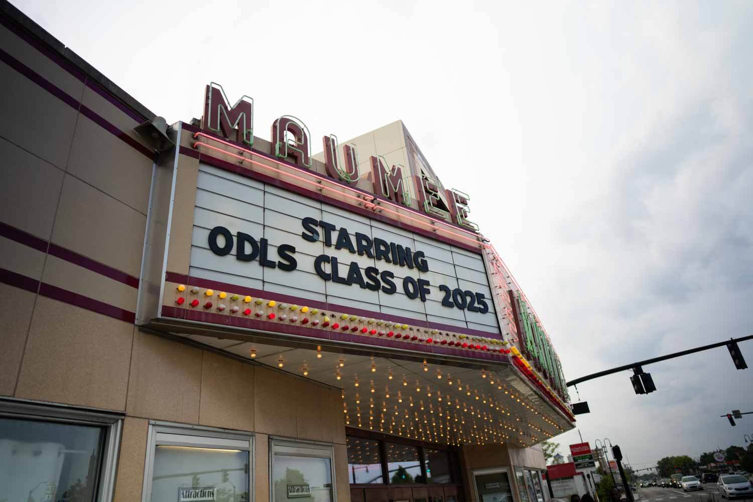 Vintage theater marquee reading "Starring ODLS Class of 2025" with bright bulbs.