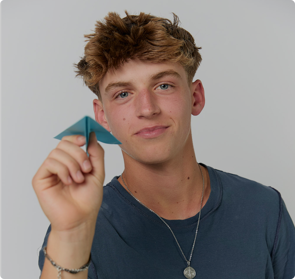 Student with a paper airplane